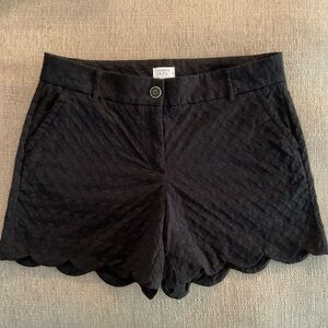 Crown & Ivy Shelby Black scalloped hem shorts.
